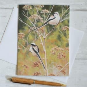 Two Long-tailed Tits feeding on Cow Parsley seeds. Autumn colours. Art card, oblong with envelope.